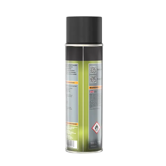 A single aerosol spray can shown upright on a plain white background, photographed from the side/back to show the label. The can has a black top and lower section, a metallic silver middle section, and a pale yellow-green label area with warning text and a hazard symbol.