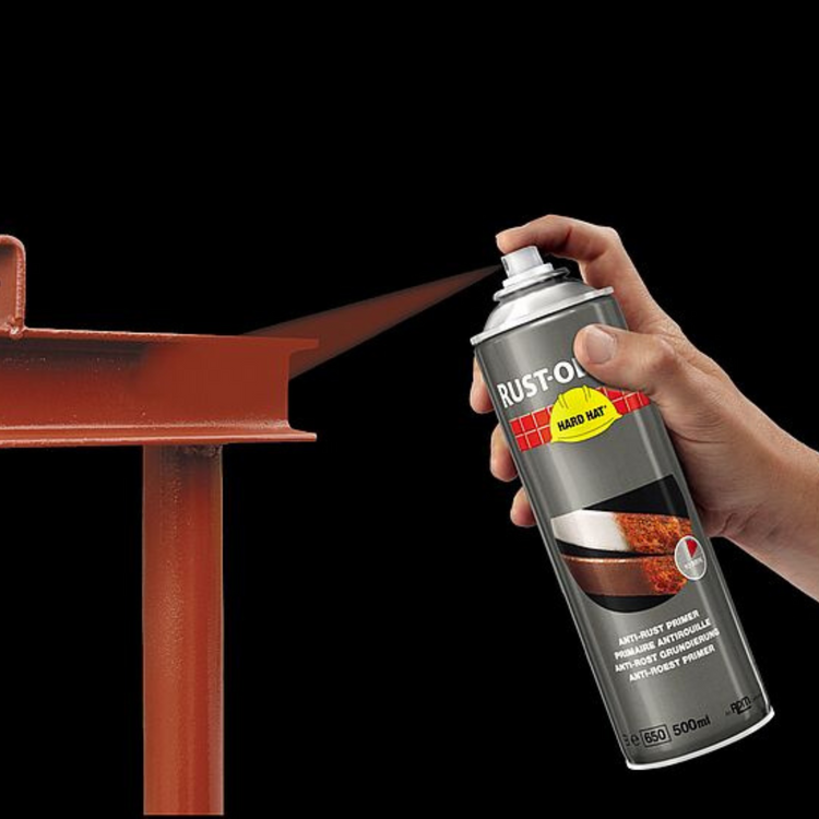 Rust-Oleum Hard Hat primer being sprayed onto a steel beam