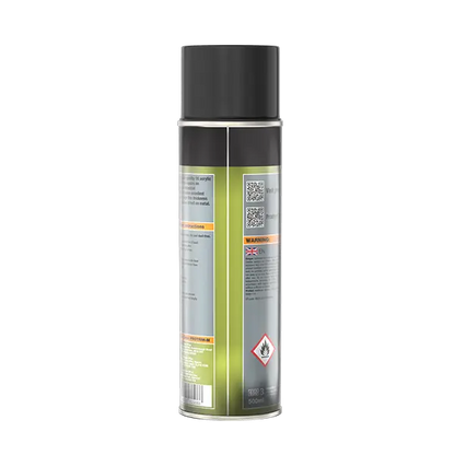 A single aerosol spray can shown upright on a plain white background, photographed from the side/back to show the label. The can has a black top and lower section, a metallic silver middle section, and a pale yellow-green label area with warning text and a hazard symbol.